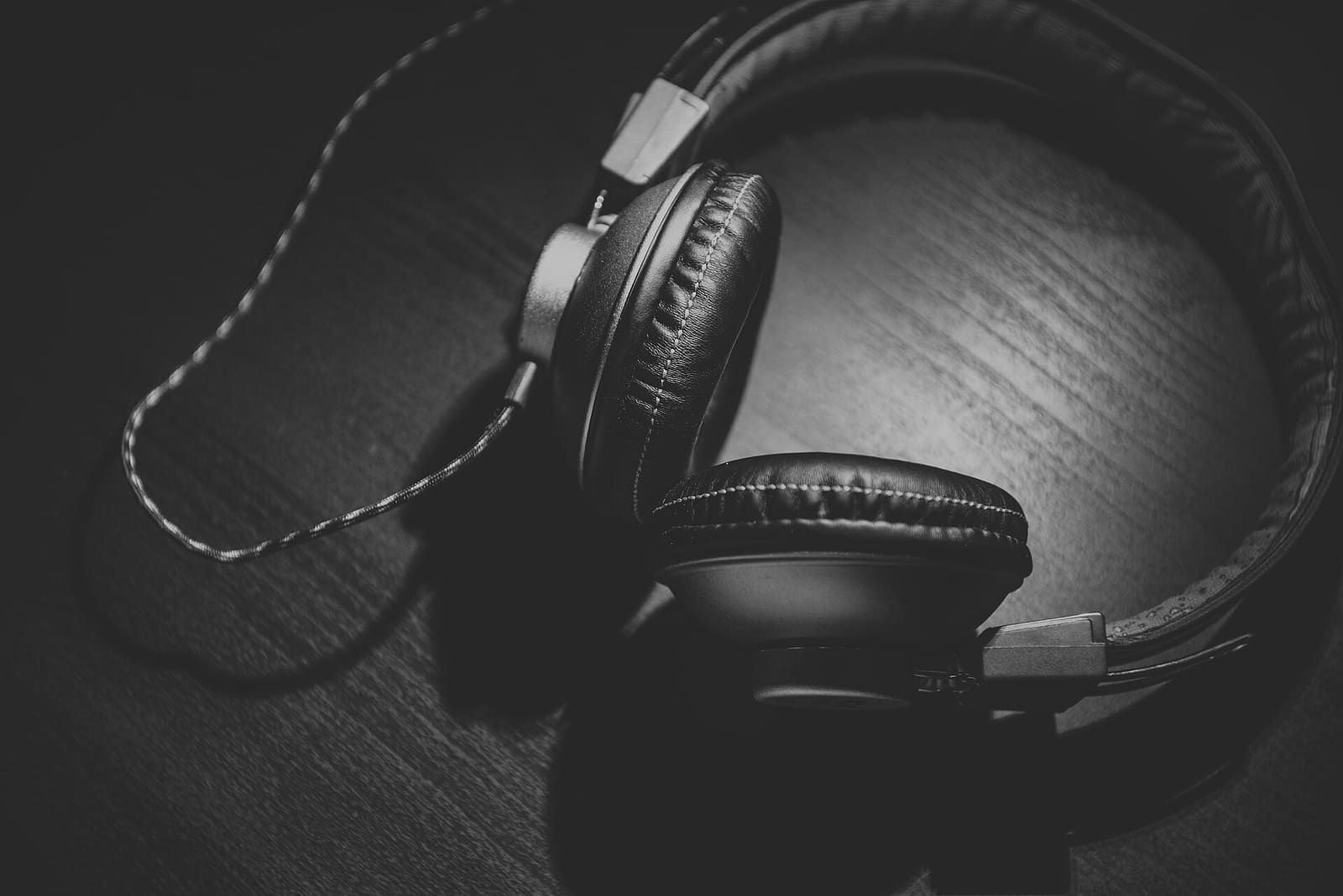 Wired headphones on a wooden table