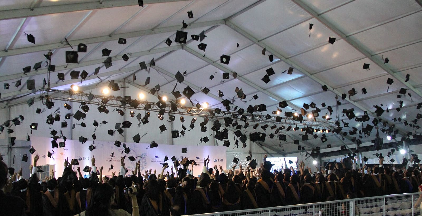 Graduates tossing their caps at a commencement ceremony