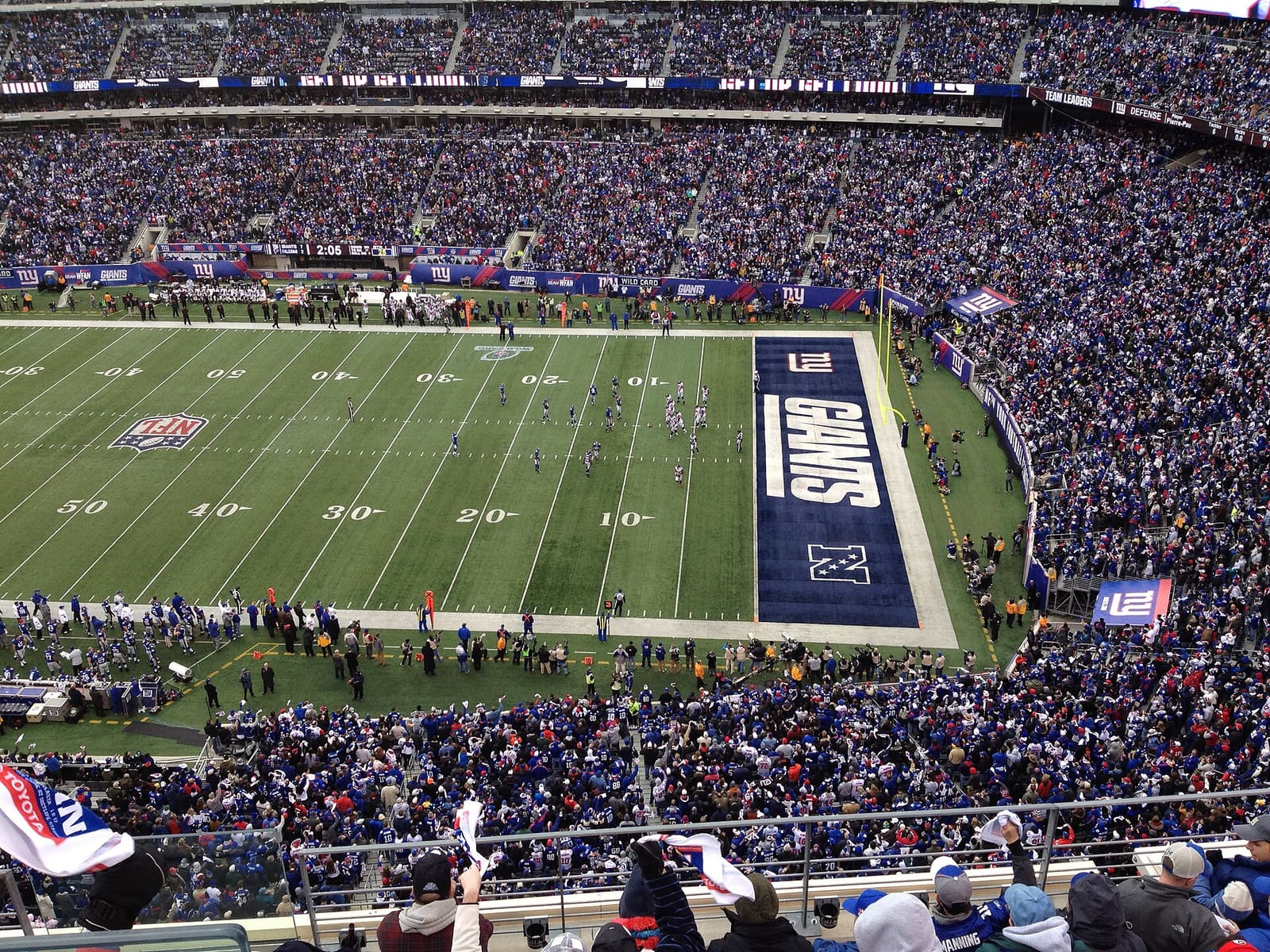 A packed MetLife Stadium in New Jersey during a game, with advertising boards