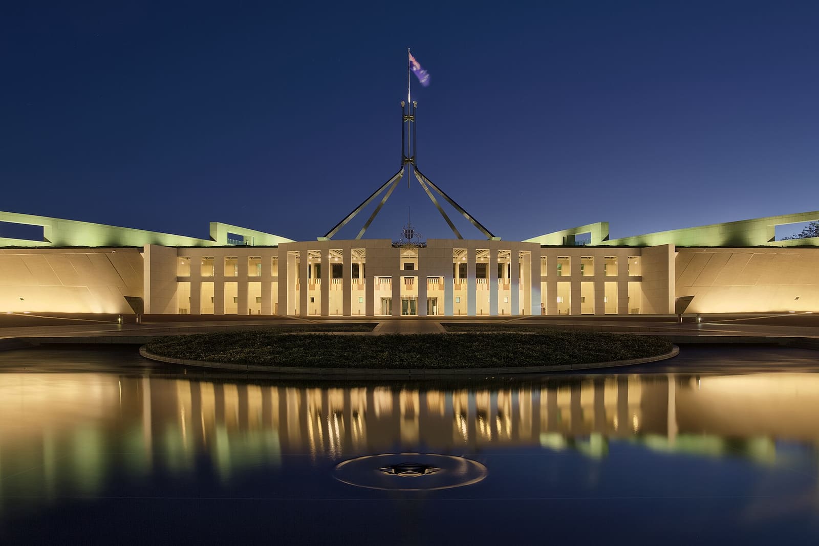 Parliament House in Canberra, Australia, lit up at dusk