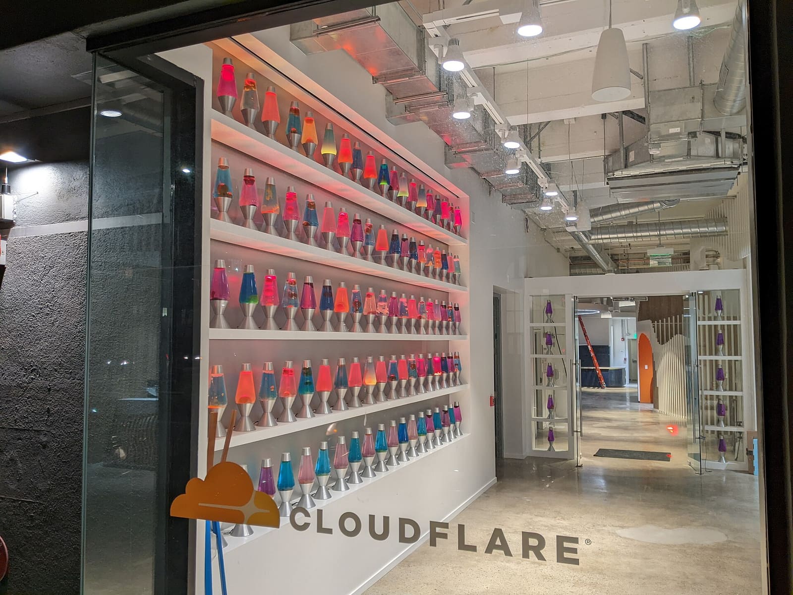 A wall of colorful lava lamps in the entrance of Cloudflare's San Francisco office