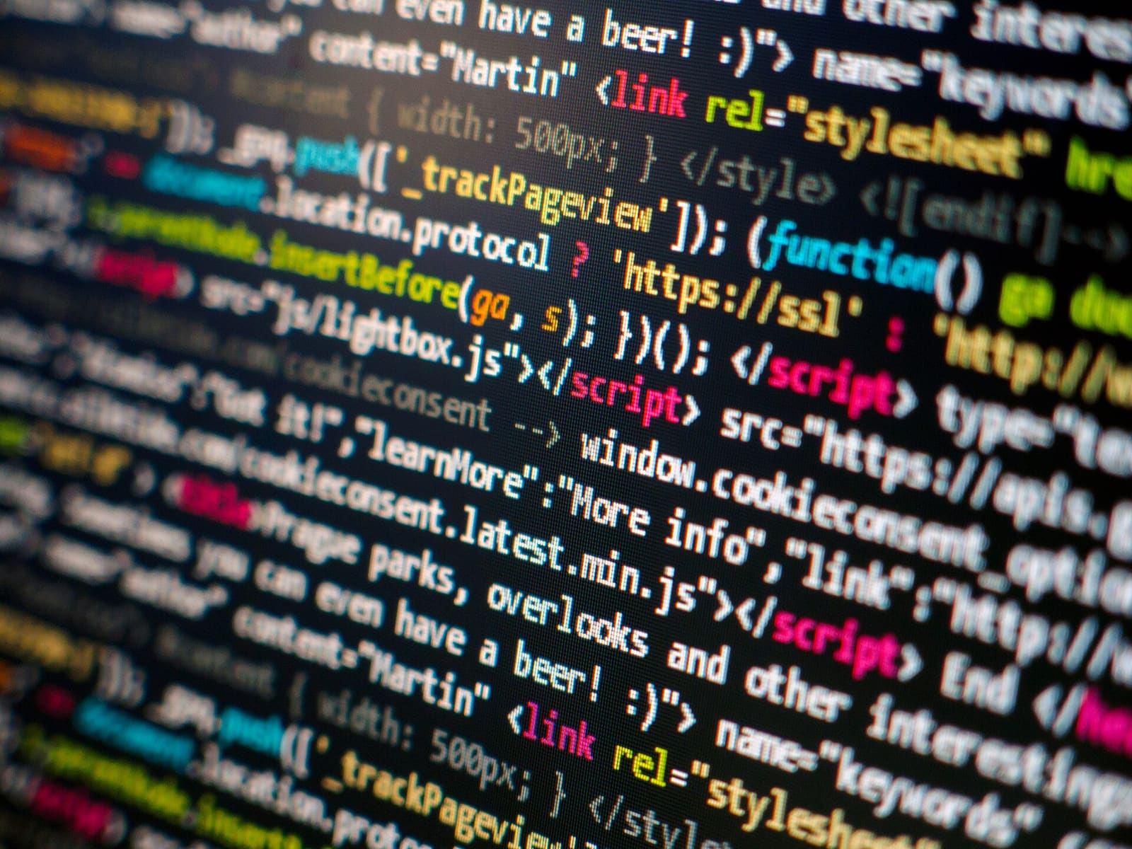 Colorful lines of HTML and JavaScript code on a computer screen