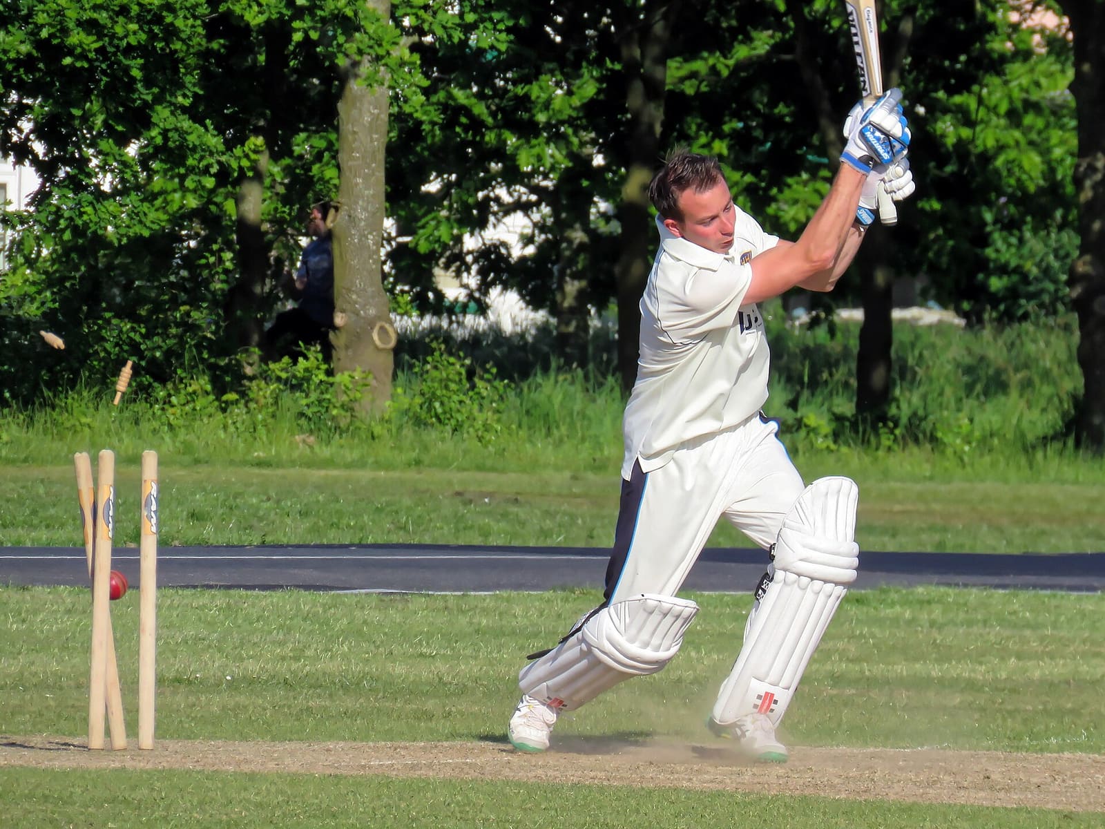 A batsman at the crease during a village cricket match
